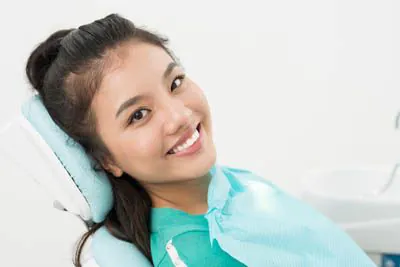 patient smiling during her appointment at Mitten Family Dental
