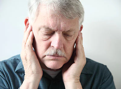 man experiencing TMJ/TMD pain