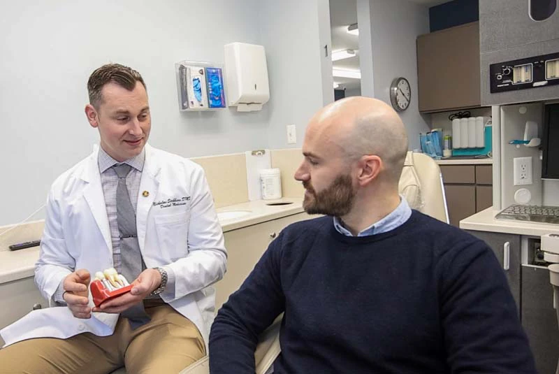 male patient getting dental care at Mitten Family Dental