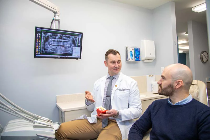 male patient getting dental care at Mitten Family Dental
